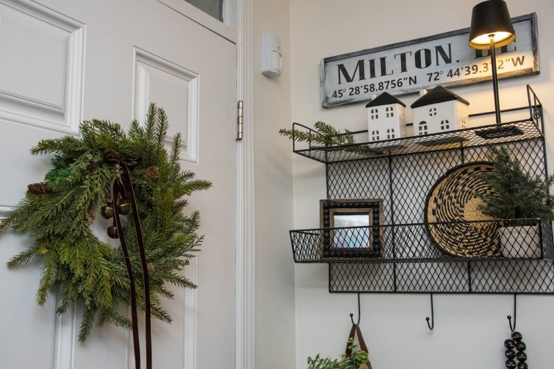 Fresh greenery adorns the door at Kelly and Chris Cole’s West Shore Drive home.